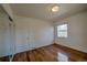 Bedroom featuring hardwood flooring and a closet at 1705 Stonehenge Dr, Lafayette, CO 80026