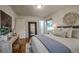 Bedroom with hardwood floors, stylish decor, and good natural light at 1705 Stonehenge Dr, Lafayette, CO 80026