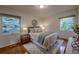 Cozy bedroom with hardwood floors, natural light, and neutral decor at 1705 Stonehenge Dr, Lafayette, CO 80026