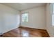 Bedroom with hardwood floors, natural light, and neutral paint at 1705 Stonehenge Dr, Lafayette, CO 80026
