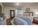 Bedroom featuring hardwood floors, a cozy decor, and ample closet space at 1705 Stonehenge Dr, Lafayette, CO 80026
