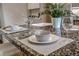 Close-up of kitchen island featuring granite countertops, tableware, and plant at 1705 Stonehenge Dr, Lafayette, CO 80026