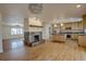 Open concept with granite counters and stainless appliances adjacent to living room at 1705 Stonehenge Dr, Lafayette, CO 80026