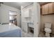 Bright laundry room with washer, sink, and adjacent half bath at 1705 Stonehenge Dr, Lafayette, CO 80026
