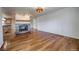 A spacious living room with hardwood floors and a stone fireplace at 1705 Stonehenge Dr, Lafayette, CO 80026