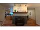 Cozy living area features a fireplace and connects seamlessly to a modern kitchen and dining area at 1705 Stonehenge Dr, Lafayette, CO 80026