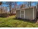 Backyard storage shed with neutral paint and double door for easy access at 1705 Stonehenge Dr, Lafayette, CO 80026