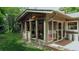 Sunroom exterior view with large windows, and a view of the backyard at 1705 Stonehenge Dr, Lafayette, CO 80026