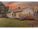 Exterior view of home's backyard featuring lawn, trees, and covered patio at 11623 W Hornsilver Mtn, Littleton, CO 80127