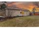 Exterior backyard with grass, trees, and the home's exterior visible at 11623 W Hornsilver Mtn, Littleton, CO 80127