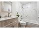 Bright bathroom with a tub shower and stylish vanity, offering a clean, modern aesthetic at 11623 W Hornsilver Mtn, Littleton, CO 80127