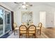 Airy dining room features a vaulted ceiling and sliding glass door to the exterior at 11623 W Hornsilver Mtn, Littleton, CO 80127