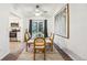 Bright dining room with modern lighting, contemporary rug, and view of the kitchen at 11623 W Hornsilver Mtn, Littleton, CO 80127