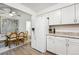 Eat-in kitchen featuring stainless steel refrigerator and view of dining area at 11623 W Hornsilver Mtn, Littleton, CO 80127