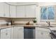 Kitchen with granite countertops, stainless steel dishwasher, and ample cabinet storage at 11623 W Hornsilver Mtn, Littleton, CO 80127