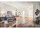 Open floor plan with living room, dining area, and hardwood floors, featuring high ceilings and bright natural light at 11623 W Hornsilver Mtn, Littleton, CO 80127