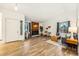 Spacious living room featuring wood flooring, a fireplace, and neutral-toned decor with ample natural light at 11623 W Hornsilver Mtn, Littleton, CO 80127