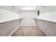 Walk-in closet with carpet, bright white walls, shelving, and rack storage at 11623 W Hornsilver Mtn, Littleton, CO 80127