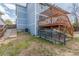 Home exterior featuring a wooden deck, stairs, and a partially fenced yard, creating an inviting outdoor area at 4022 S Kalispell St, Aurora, CO 80013