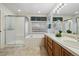 Main bathroom with double vanity, shower, and bathtub at 1894 S Marshall Cir, Lakewood, CO 80232