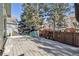 Backyard deck with a bench and a view of the surrounding trees and neighborhood at 1894 S Marshall Cir, Lakewood, CO 80232