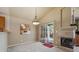 Spacious dining area featuring a fireplace and sliding glass doors to a deck at 1894 S Marshall Cir, Lakewood, CO 80232