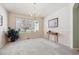 Bright dining room with large window and wood floors at 1894 S Marshall Cir, Lakewood, CO 80232