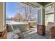 Inviting front porch with rocking chairs and street view at 1894 S Marshall Cir, Lakewood, CO 80232