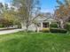 Spacious front yard with lush green grass and mature trees, creating a welcoming atmosphere at 1894 S Marshall Cir, Lakewood, CO 80232