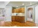 Hallway with built-in cabinetry and hardwood floors at 1894 S Marshall Cir, Lakewood, CO 80232