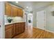 View of kitchen with wood cabinets and hardwood floors at 1894 S Marshall Cir, Lakewood, CO 80232