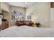 Living room with vaulted ceiling, fireplace and brown sectional sofa at 1894 S Marshall Cir, Lakewood, CO 80232