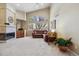 Living room with vaulted ceilings, fireplace, and large window at 1894 S Marshall Cir, Lakewood, CO 80232