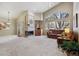 Bright living room featuring a fireplace and large windows at 1894 S Marshall Cir, Lakewood, CO 80232