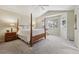 Main bedroom with carpeted floors, large windows, and a ceiling fan at 1894 S Marshall Cir, Lakewood, CO 80232