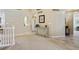 Upper hallway with neutral carpeting and access to bedrooms at 1894 S Marshall Cir, Lakewood, CO 80232