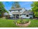Expansive backyard featuring a patio, well-manicured lawn, and a charming water fountain at 3765 E Easter Dr, Centennial, CO 80122