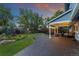 Manicured backyard features a paved patio with outdoor seating, a firepit and a fountain at 3765 E Easter Dr, Centennial, CO 80122