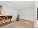 Basement featuring an exercise bike, pinball machine and large closet with paneled doors at 3765 E Easter Dr, Centennial, CO 80122