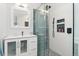Modern bathroom with a glass-enclosed shower, white tile, and a vanity with storage at 3765 E Easter Dr, Centennial, CO 80122
