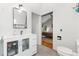 Contemporary bathroom with a sleek vanity, modern fixtures, and tiled floors at 3765 E Easter Dr, Centennial, CO 80122