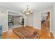 Elegant dining room with hardwood floors, a chandelier, and access to other living spaces at 3765 E Easter Dr, Centennial, CO 80122