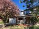 Inviting home with brick accents, a flowering tree, and a well-maintained front yard at 3765 E Easter Dr, Centennial, CO 80122