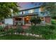 Beautiful home with lush landscaping, brick accents, and a welcoming front porch at 3765 E Easter Dr, Centennial, CO 80122