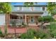 Charming two-story home with a brick facade, a welcoming front porch and professionally landscaped yard at 3765 E Easter Dr, Centennial, CO 80122