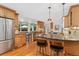 Spacious kitchen with stainless steel appliances, granite countertops, and a view to the backyard at 3765 E Easter Dr, Centennial, CO 80122