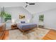 Serene main bedroom featuring wood floors, vaulted ceiling, neutral tones, and ample natural light at 3765 E Easter Dr, Centennial, CO 80122