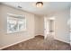 Bedroom featuring carpet, a window, and a doorway leading to another room, providing a spacious layout at 2903 Dragonfly Ct, Castle Rock, CO 80109