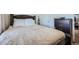 The bedroom boasts a soft bed and classic wood furniture, offering a comfortable retreat at 5541 Killarney Ct, Denver, CO 80249
