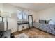 Stylish bedroom with a black daybed, a modern mirror, and natural light at 5541 Killarney Ct, Denver, CO 80249